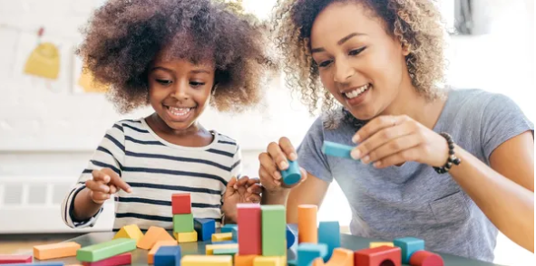 Therapist and child playing with blocks